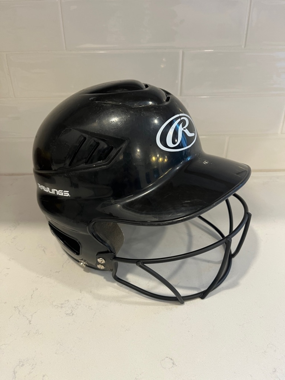 Rawlings Black Batting Helmet with Face Guard Cage. Fits sizes 6.5 - 7.5